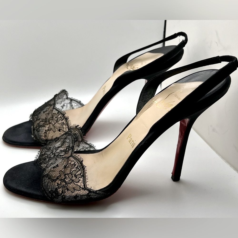 Christian Louboutin lace and satin slingback sandals.